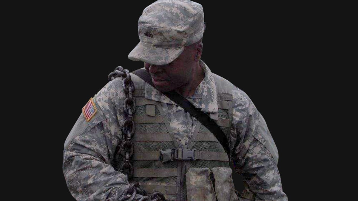 Maryland National Guard Sgt. Bruce Weaver wearing a chain as discipline.