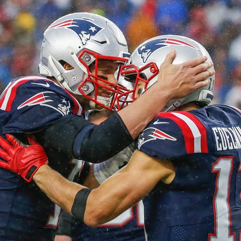 Tom Brady celebrates with Julian Edelman after a t