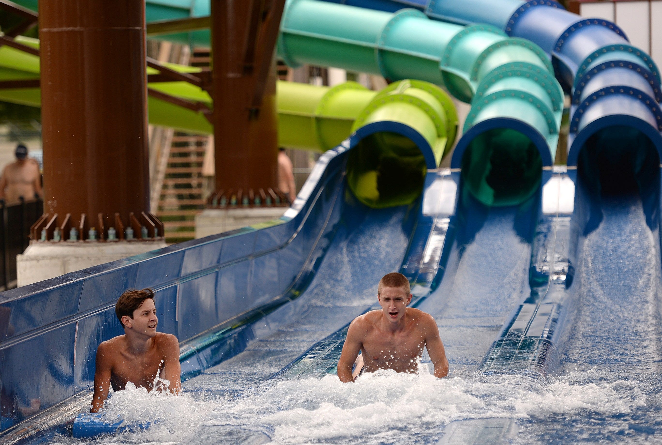 Vincent Kloecker, 16, left, and Peter Frisina, 19, right, both of Erie, ride the Rally Racer on July 22, 2020 at Waldameer Park & Water World in Millcreek Township. Attendance at the park is down due to COVID-19.