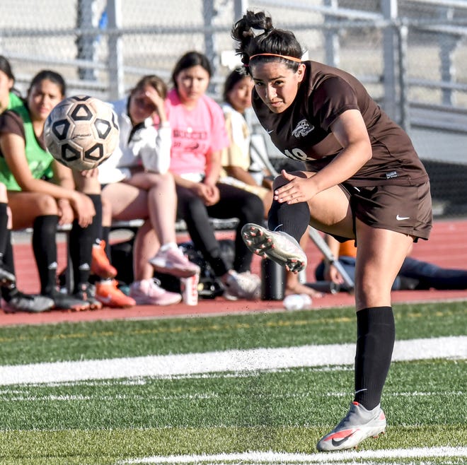 Garden City High School's Wendy Zamudio moves the ball upfield to an open teammate April 8 at Buffalo Stadium against Great Bend.