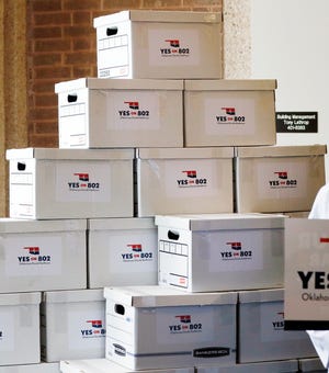 Boxes of petitions for State Question 802 to put Medicaid expansion on the ballot are stacked for delivery to the Oklahoma Secretary of State's office in 2019.