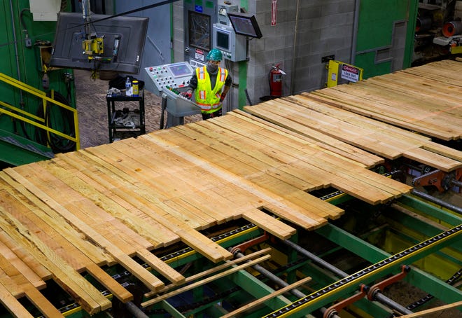 Freshly cut lumber heads through a sorting station in April 2021 at the Eugene sawmill now owned by Sierra Pacific Industries.