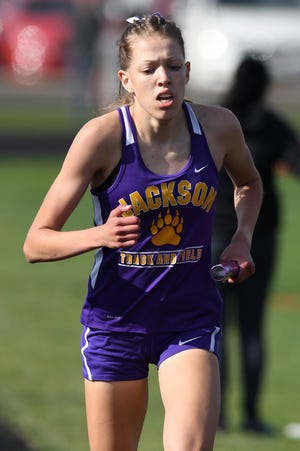 Kailey Zagst runs the anchor for Jackson as they defeated Perry in the girls 4x800 relay as Perry took on Jackson at Jackson Tuesday , April 13, 2021.
