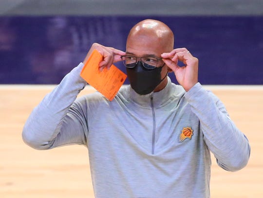 Phoenix Suns head coach Monty Williams adjust his glasses during a timeout against the Miami Heat during the first quarter in Phoenix April 13, 2021.