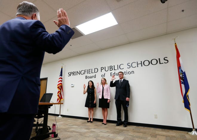 New members of the Springfield school board Maryam Mohammadkhani, Danielle Kincaid, and Scott Crise are sworn in Tuesday by Greene County Clerk Shane Schoeller.