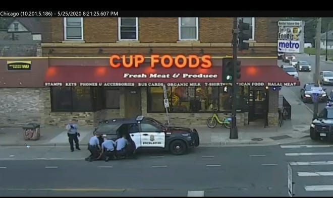 In this May 25, 2020 file image from Minneapolis city surveillance video, Minneapolis police are seen attempting to take George Floyd into custody in Minneapolis, Minn. The video was shown as Hennepin County Judge Peter Cahill presided on Monday, March 29, 2021, in the trial of former Minneapolis police officer Derek Chauvin, in the death of Floyd at the Hennepin County Courthouse in Minneapolis, Minn. (Court TV via AP, Pool, File) ORG XMIT: CER903