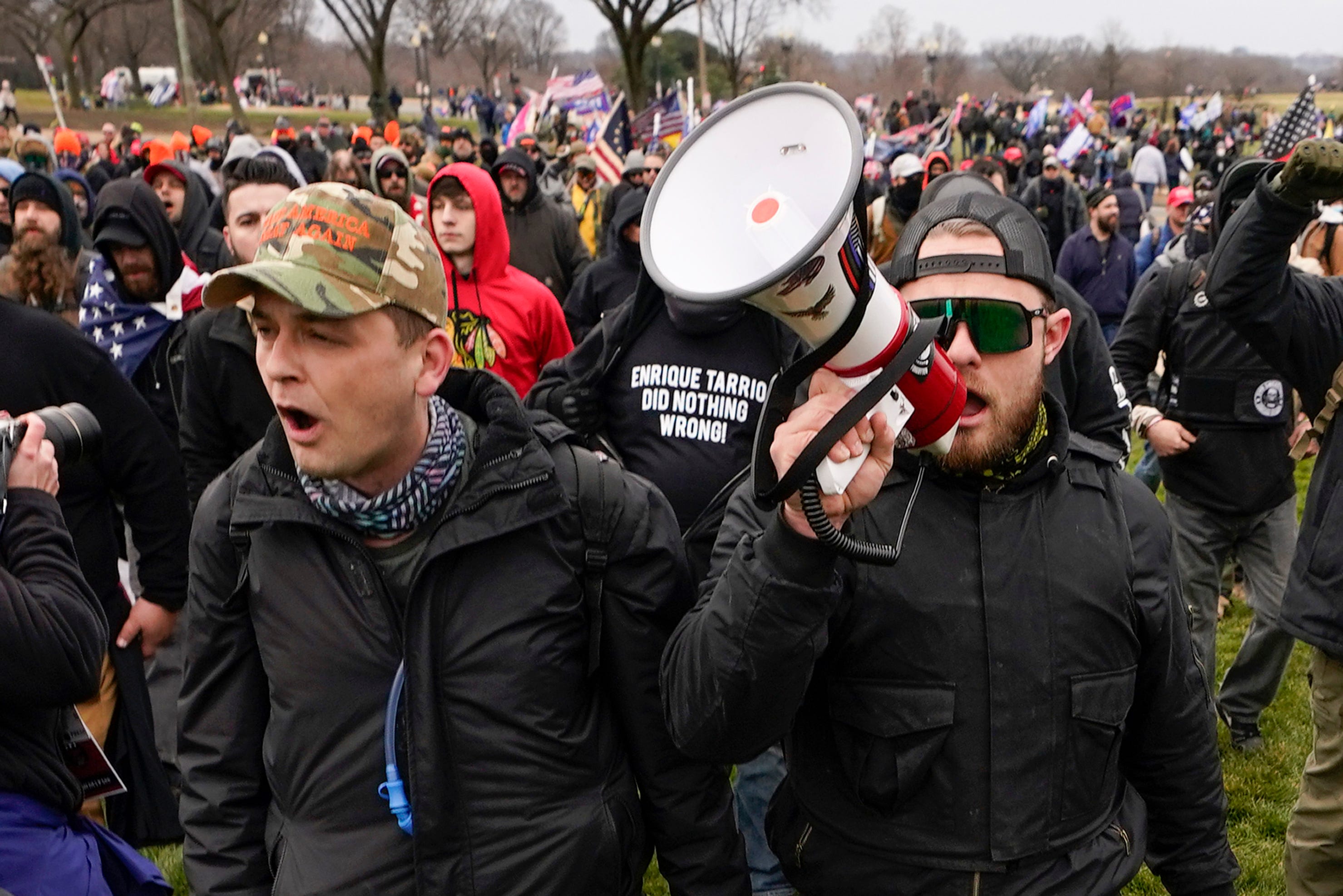 Philadelphia Proud Boys leader Zachary Rehl, left, and Seattle Proud Boys leader Ethan Nordean, right, walk toward the U.S. Capitol on Jan. 6, 2021. Both have been charged in the insurrection.