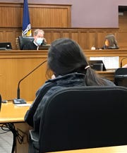 Cheyanne Wierichs, in the foreground, sits before Judge Keith Mehn of the Kewaunee County Circuit Court during an April 15 hearing that converted her $ 25,000 signature bond into a $ 5,000 cash bond.  Wierichs is charged with child neglect leading to the death of her 7-month-old daughter and two drug-related charges.