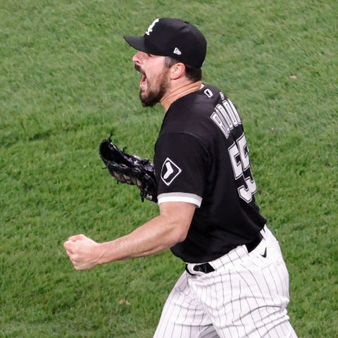Chicago White Sox pitcher Carlos Rodon reacts afte