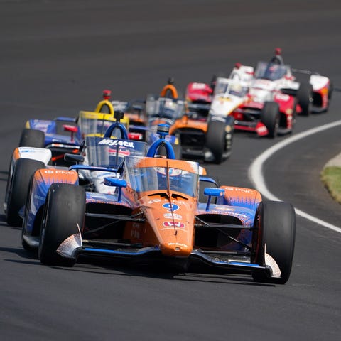 Scott Dixon, front, will attempt to win his record