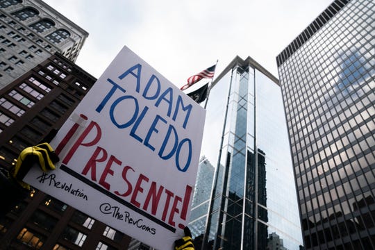 Demonstrators gather in Freedom Plaza in downtown demanding justice for 13-year-old Adam Toledo, who was killed last month by a Chicago police officer on April 14, 2021.