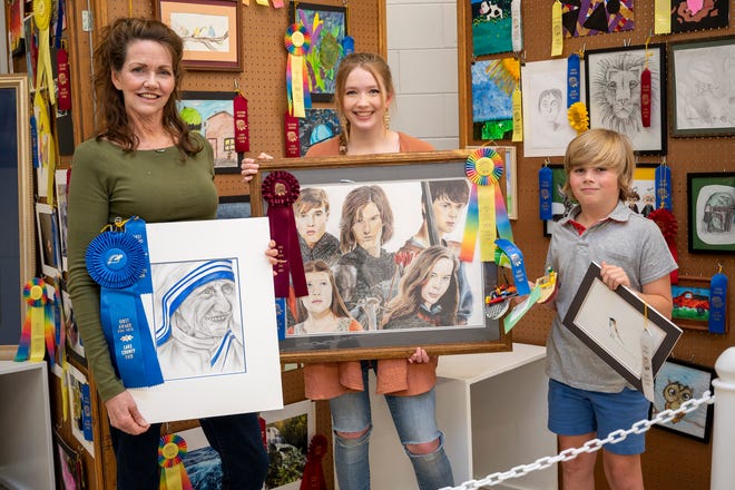The King family, Lyn, Madeline and Max, all entered drawings into the Lake County Fair’s fine arts competition. [Cindy Peterson/Correspondent]