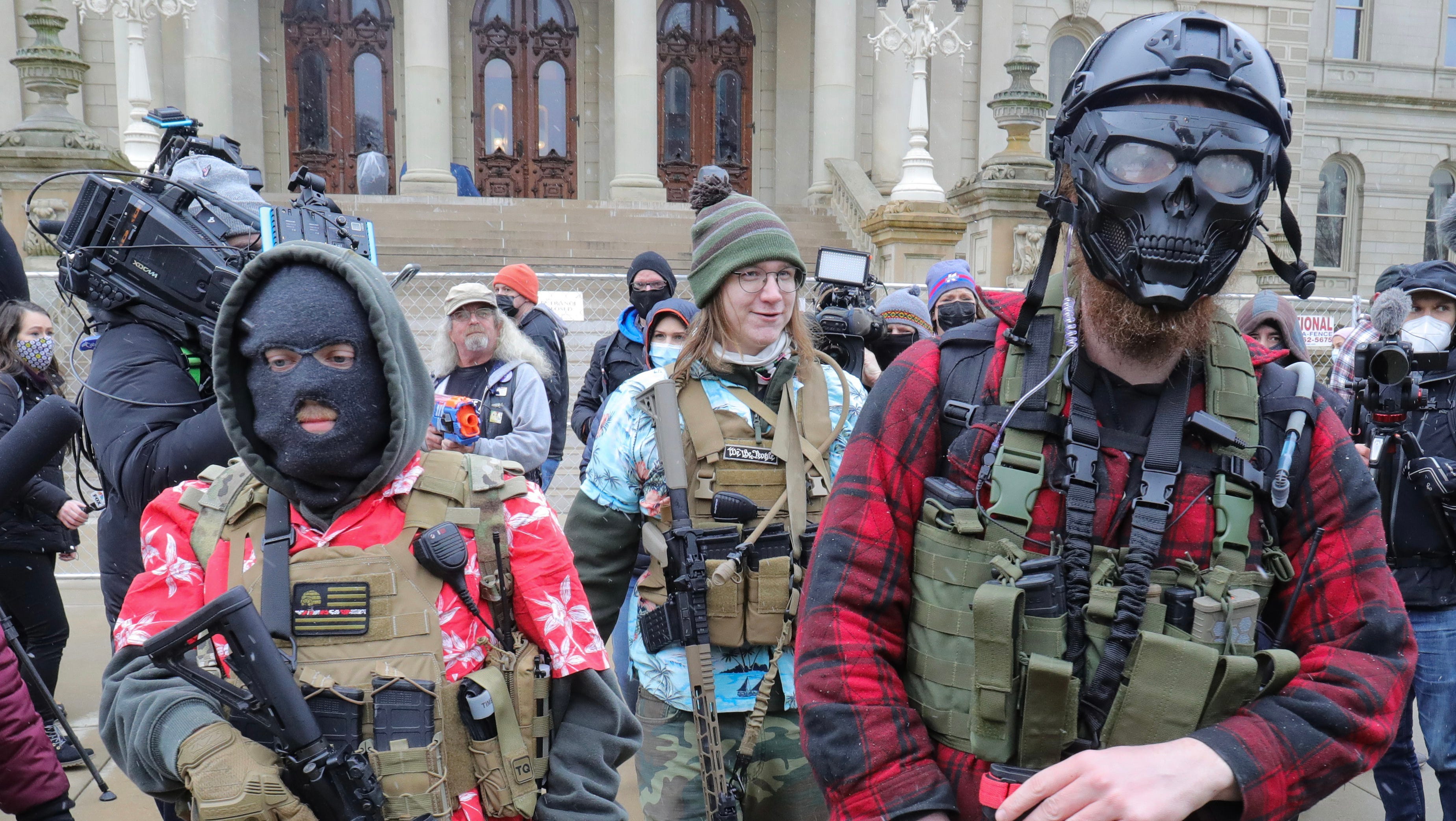 Armed members of the Boogaloo Bois are seen outside of the Capitol building in Lansing on Sunday, January 17, 2021.