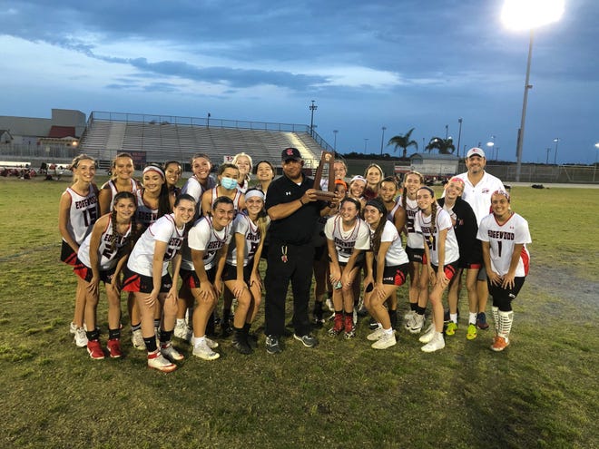 Edgewood girls pose with District 7-1A lacrosse trophy.