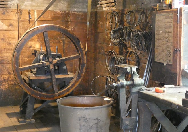 Workers at Bucyrus Copper Kettle Works use traditional tools and techniques to create everything from candy and apple butter kettles to timpani shells.