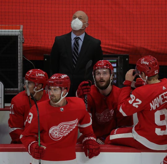 Red Wings coach Jeff Blashill looks at the scoreboard in the second period on Thursday, April 15, 2021, at Little Caesars Arena.