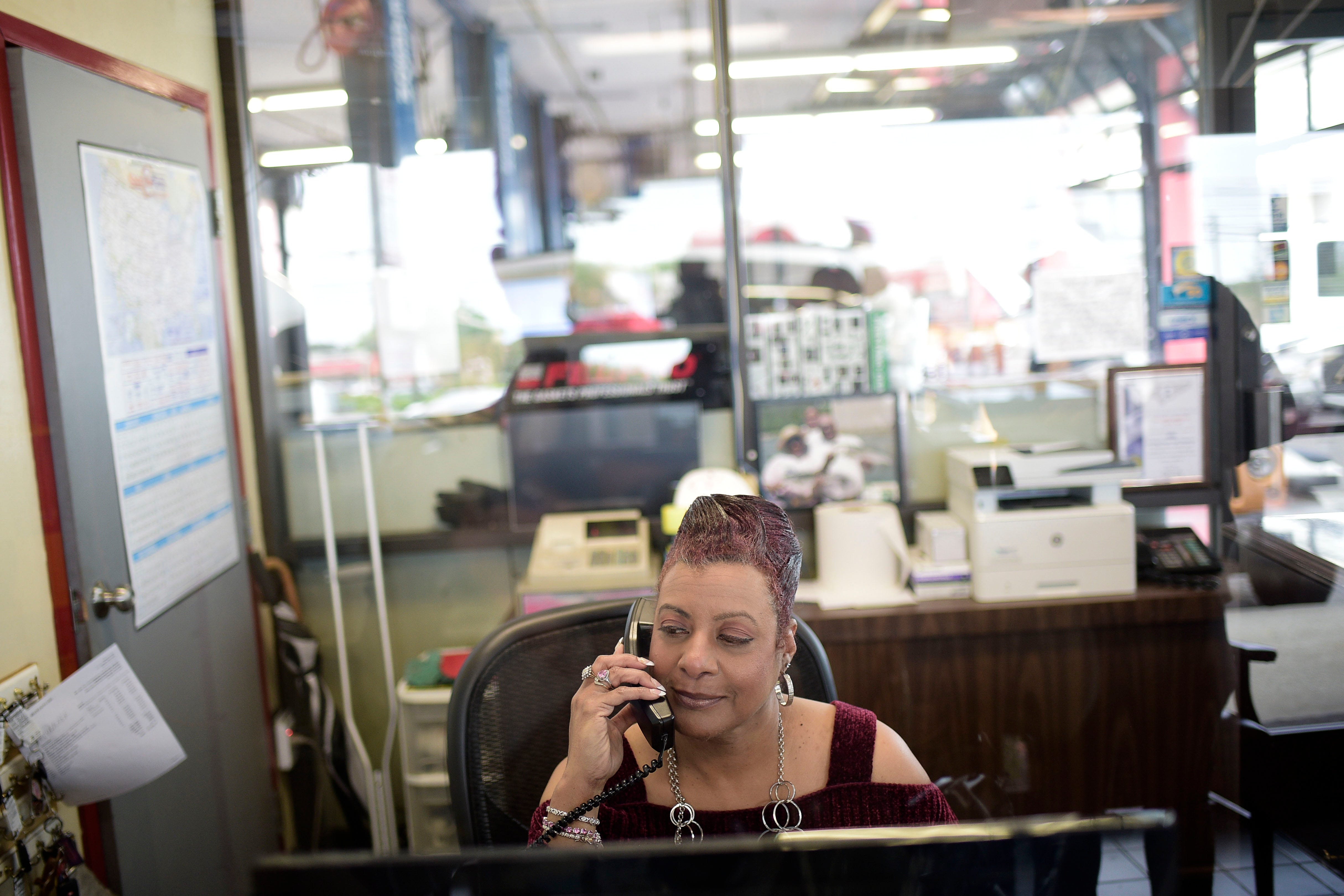 Pam Brown works in the lobby of Mr. Cool's AC Transmission & Brake Service in Knoxville, Tennessee on Friday, April 16, 2021.