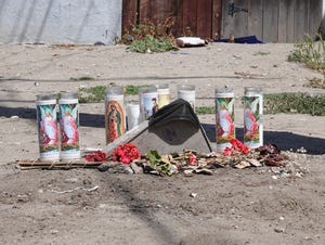 Flowers and prayer candles could be seen in the 600 block of Howell Road in south Oxnard nearly two weeks after a fatal shooting in April 2021.