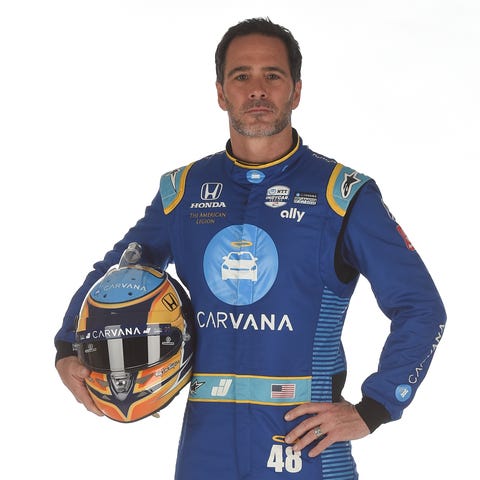 Jimmie Johnson poses in his firesuit ahead of the 