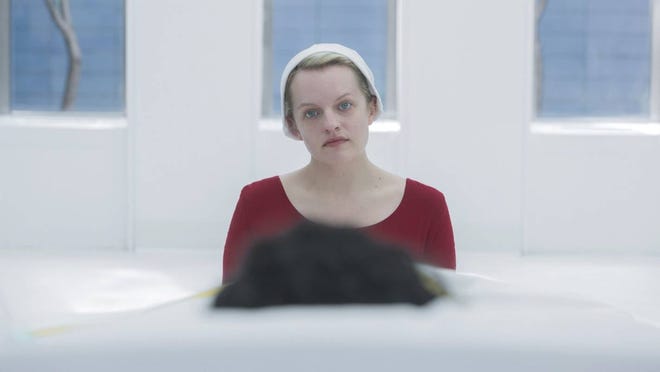 Offred (Elisabeth Moss) patiently waiting for Season 4 to begin.