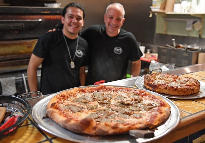 Fav’s Italian Cucina owner Michael Favasuli, right, with Chris Rebullosa, has taken a hands-on approach to his restaurant for 22 years.