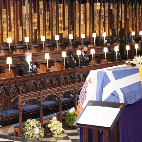Queen Elizabeth II, left, looks at the coffin of P