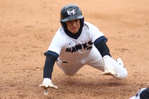 Andrew Leal dives safely into third base for Hendrickson in the middle inning against Weiss April 17 at Dell Diamond. Hendrickson defeated Weiss via run rule 11-1 to end the game.