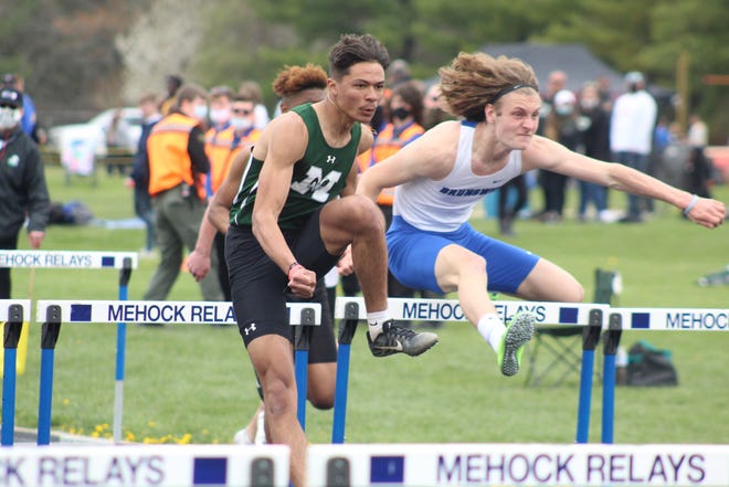 Madison's Isaac Brooks competes in the boys 300-meter hurdles during the 88th Mehock Relays on Saturday at Mehock Field. Brooks won the event.