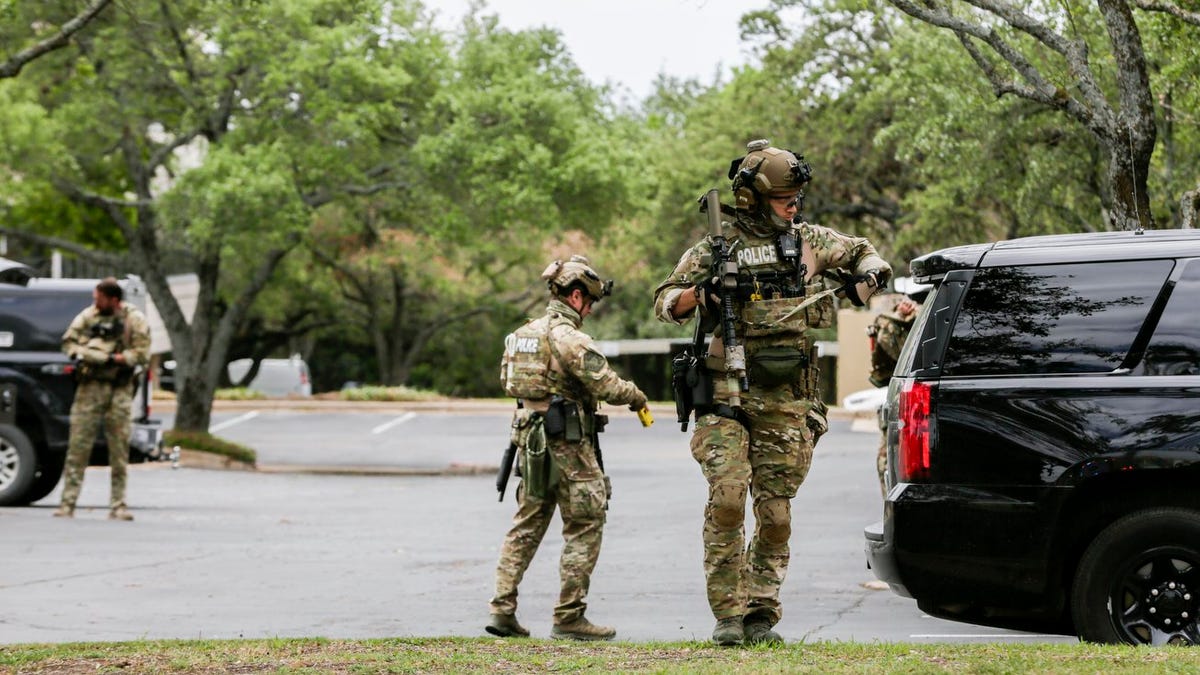Austin police, SWAT and medical personnel respond to an active shooter situation located Great Hills Trail in Northwest Austin on Sunday, April 18, 2021. 