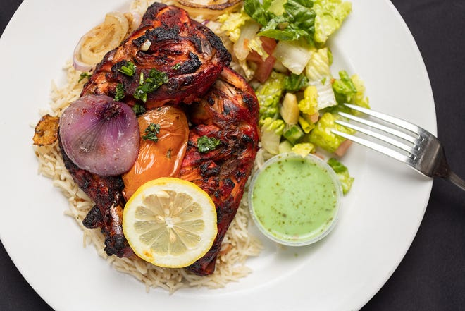 Chicken leg & thigh with rice and salad at Jasmine Fusion Cuisine