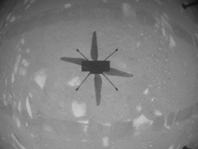 NASA’s Ingenuity Mars Helicopter took this shot while hovering over the Martian surface on April 19, 2021, during the first instance of powered, controlled flight on another planet.