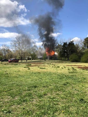 A firefighter suffered minor injuries at a house fire in Laurel Sunday, April 18.