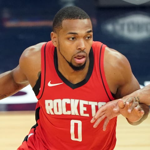 The Houston Rockets' Sterling Brown, left, working