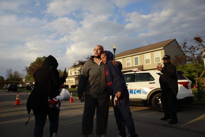 Hazel Bryant is embraced after addressing a crowd with her anger at Columbus police over the fatal shooting of her niece on Legion Lane on the Southeast Side.