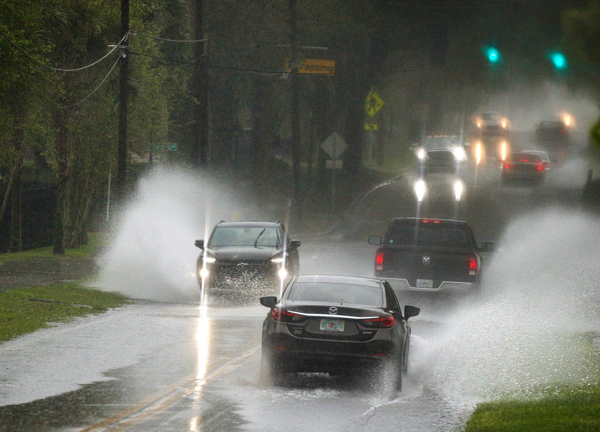 Is it dangerous for Florida drivers to use flashers in a heavy storm? Yes