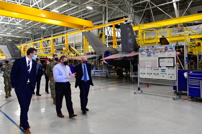Shane Robertson (center), 570th Aircraft Maintenance Squadron director, briefs U.S. Rep. Blake Moore (left), R-Utah, and Acting Secretary of the Air Force John Roth during a visit to Hill Air Force Base, Utah, March 24, 2021.