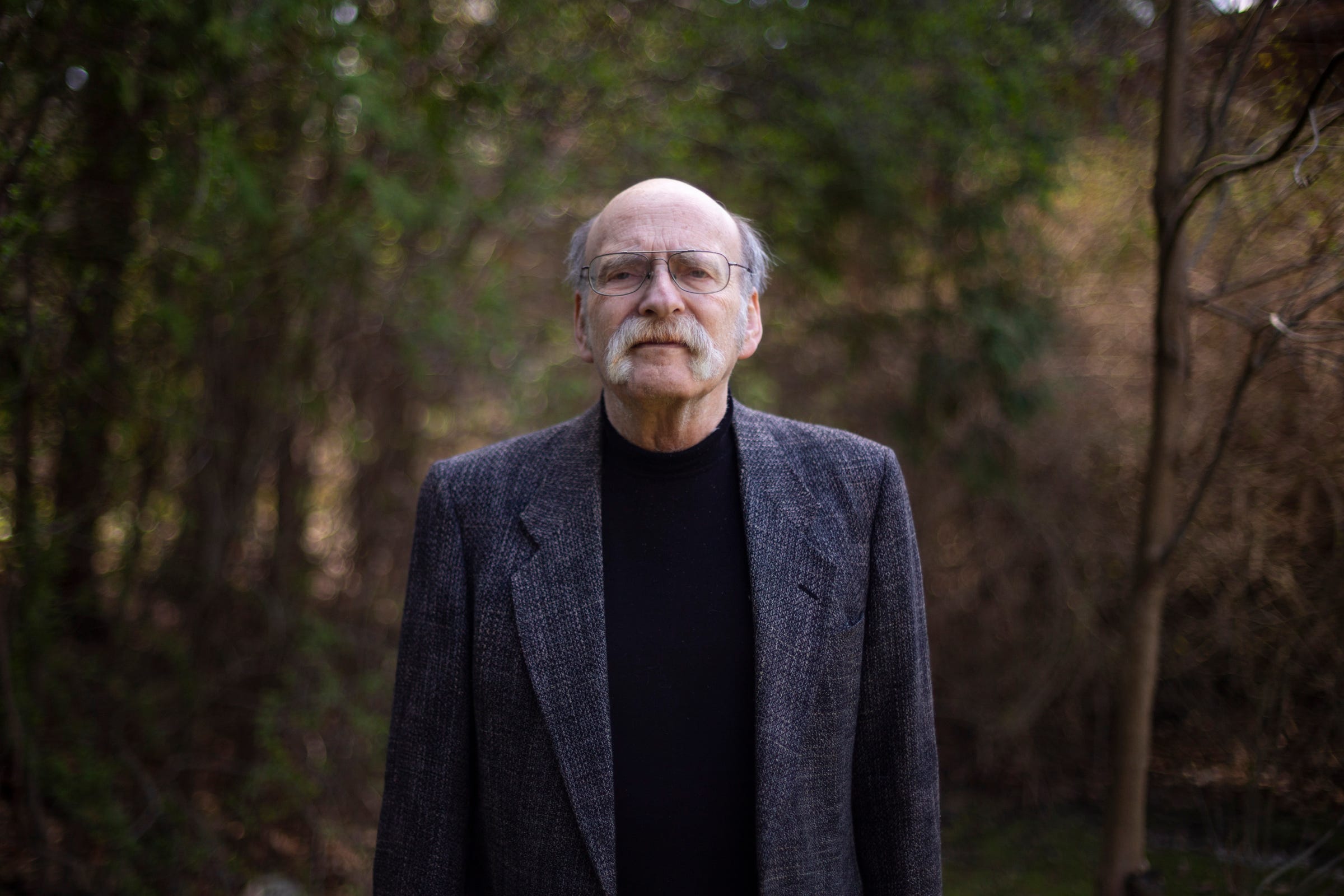 Mark Reinstein, former CEO of Mental Health Association in Michigan, poses for a portrait outside his Ann Arbor home on Tuesday, April 13, 2021.