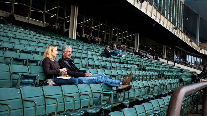 “World Traveler: An Irreverent Guide” authors Anthony Bourdain and Laurie Woolever.