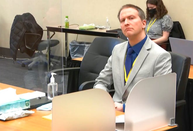 In this image from video, former Minneapolis police Officer Derek Chauvin listens as his defense attorney Eric Nelson gives closing arguments as Hennepin County Judge PeterÂ Cahill preside Monday, April 19, 2021, in the trial of Chauvin at the Hennepin County Courthouse in Minneapolis. Chauvin is charged in the May 25, 2020 death of George Floyd.  (Court TV via AP, Pool)