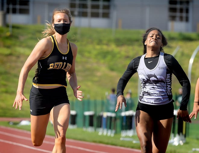 Red Lion's Camree Patterson, left, edges South Western's Dajae Boardley-Wise to win the 100-meter dash during a track and field meet at Red Lion Tuesday, April 20, 2021. Bill Kalina photo