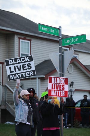 Demonstrators gather at the corner of Templar Street and Legion Lane following a fatal police shooting on Tuesday, April 20, 2021 near Legion Lane on the east side of Columbus, Ohio. Columbus Police responded around 4:35 p.m. Tuesday following a 911 call where the caller reported that someone was trying to stab them and then hung up. The person shot was then transported to Mount Carmel East where she later died at 5:21 p.m., according to Columbus Police.