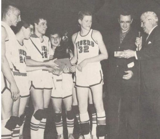 Ed Yackey, Gary Phillips, John Studer, Tom Ferris, Charlie Jones and Coach Charlie Huggins receive the 1967 state championship trophy from Paul Landis, Commissioner of the OHSAA.
