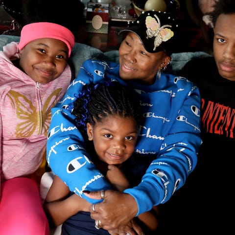 Tonya Williams, 69, of Flint with her grandkids (L