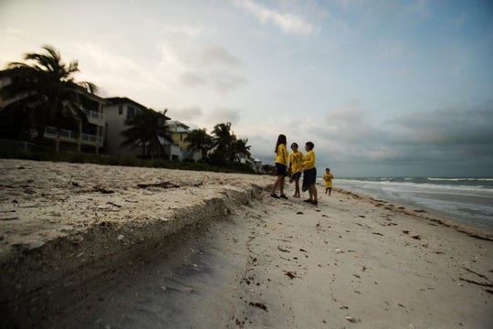 Turtle Time volunteer Rachel Barnhart gives an orientation to new Turtle Time volunteers Christy Williams and her sons, Brayden,12, and Bryson, 7, on Bonita Beach on Wednesday, April, 21, 2021. They have no nests yet but nesting season starts soon. 