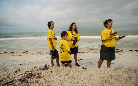 Turtle Time volunteer Rachel Barnhart gives an orientation to new Turtle Time volunteers Christy Williams and her sons, Brayden,12, and Bryson, 7, on Bonita Beach on Wednesday, April, 21, 2021. They have no nests yet but nesting season starts soon. Here, Rachel talks with another Turtle Time volunteer. The volunteers monitor the beaches for nests, hatchlings and more.