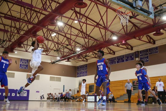 Cesar Chavez' TyQuan Solomon (2) takes a shot against North during a game in Phoenix April 19, 2021.