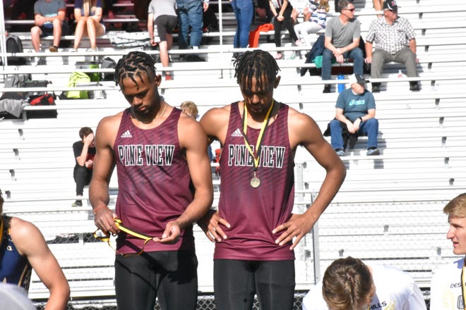Marcus (left) and Dom (right) McKenzie pose on the podium after taking first during a relay race at the Desert Hills Invitational on April 23. The twin brothers, both of whom starred at both football and track, announced Monday they planned to attend Brigham Young University.