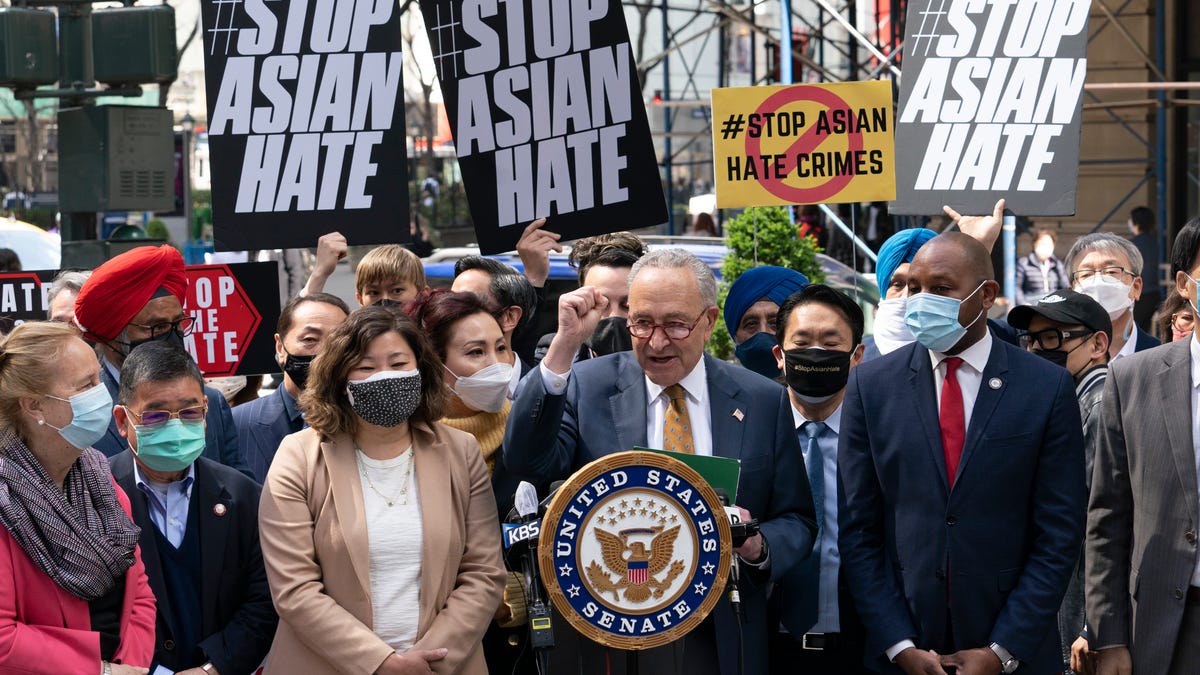 Senate Majority Leader Chuck Schumer, D-N.Y., center, is joined by U.S. Rep. Grace Meng, D-N.Y., third from left, at a news conference to discuss an Asian-American hate crime bill, Monday, April 19, 2021, in New York. Schumer is pushing for passage of the COVID-19 Hate Crimes Act in the Senate. (AP Photo/Mark Lennihan) ORG XMIT: NYML103