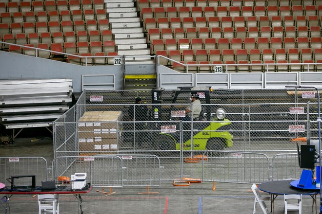 Ballots from the Maricopa County 2020 elections arrive at the Arizona Veterans Memorial Coliseum to be recounted in Phoenix on April 22, 2021.