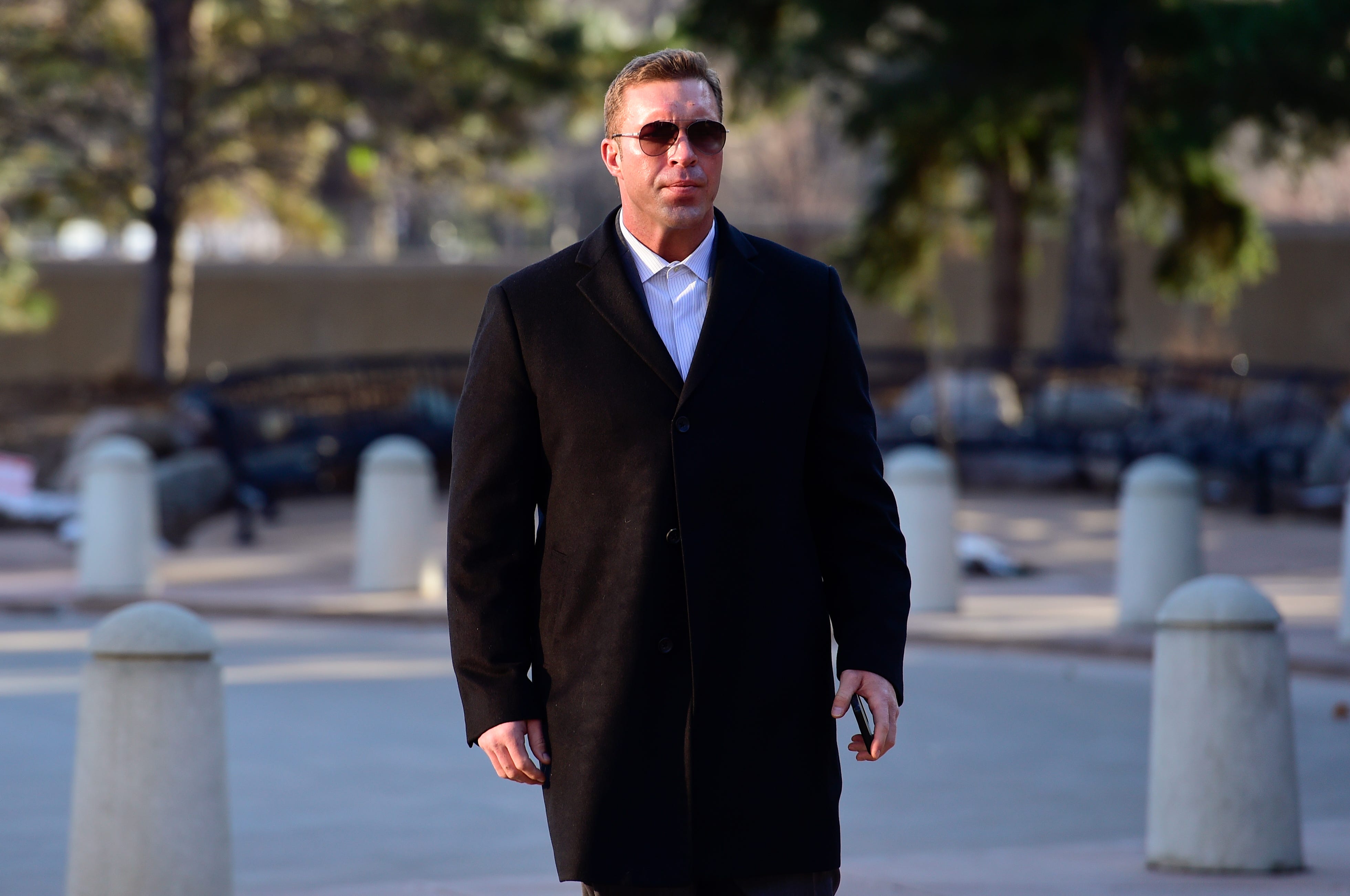 Justin Bannan walks toward the Boulder County Justice Center before a preliminary hearing on Dec. 9, 2019.